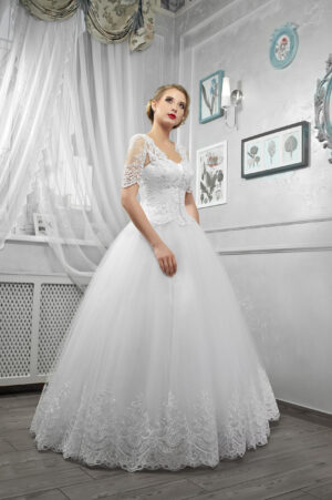 Young beautiful bride, woman in long white wedding dress on whit Velvet Whisper