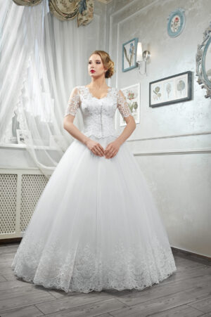Young beautiful bride, woman in long white wedding dress on whit Velvet Whisper